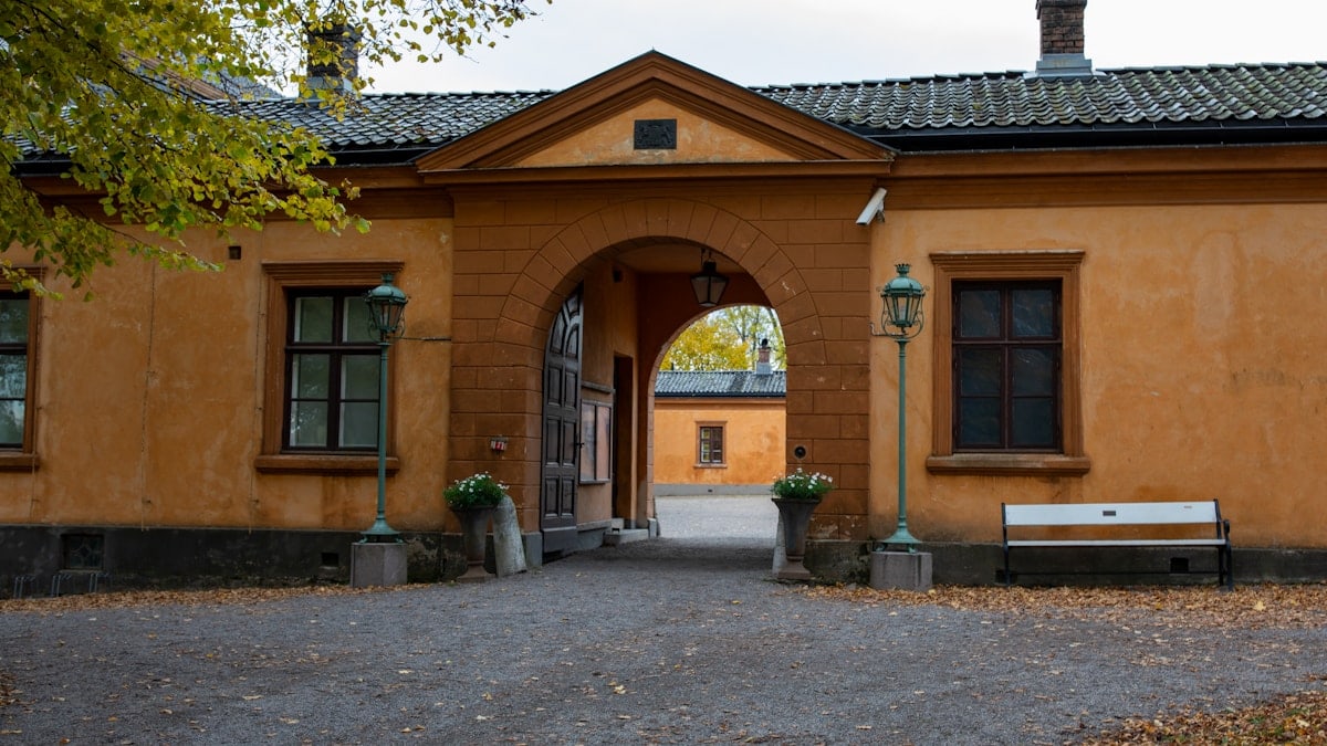 Orange building with a large archway entrance